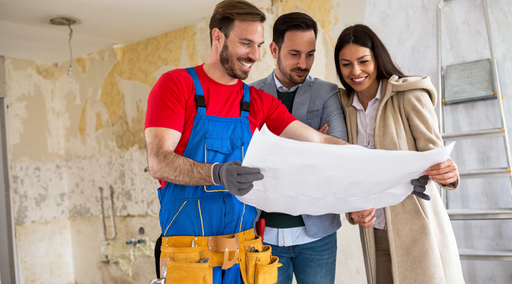 Construction Contractor Reviewing Plans with Clients